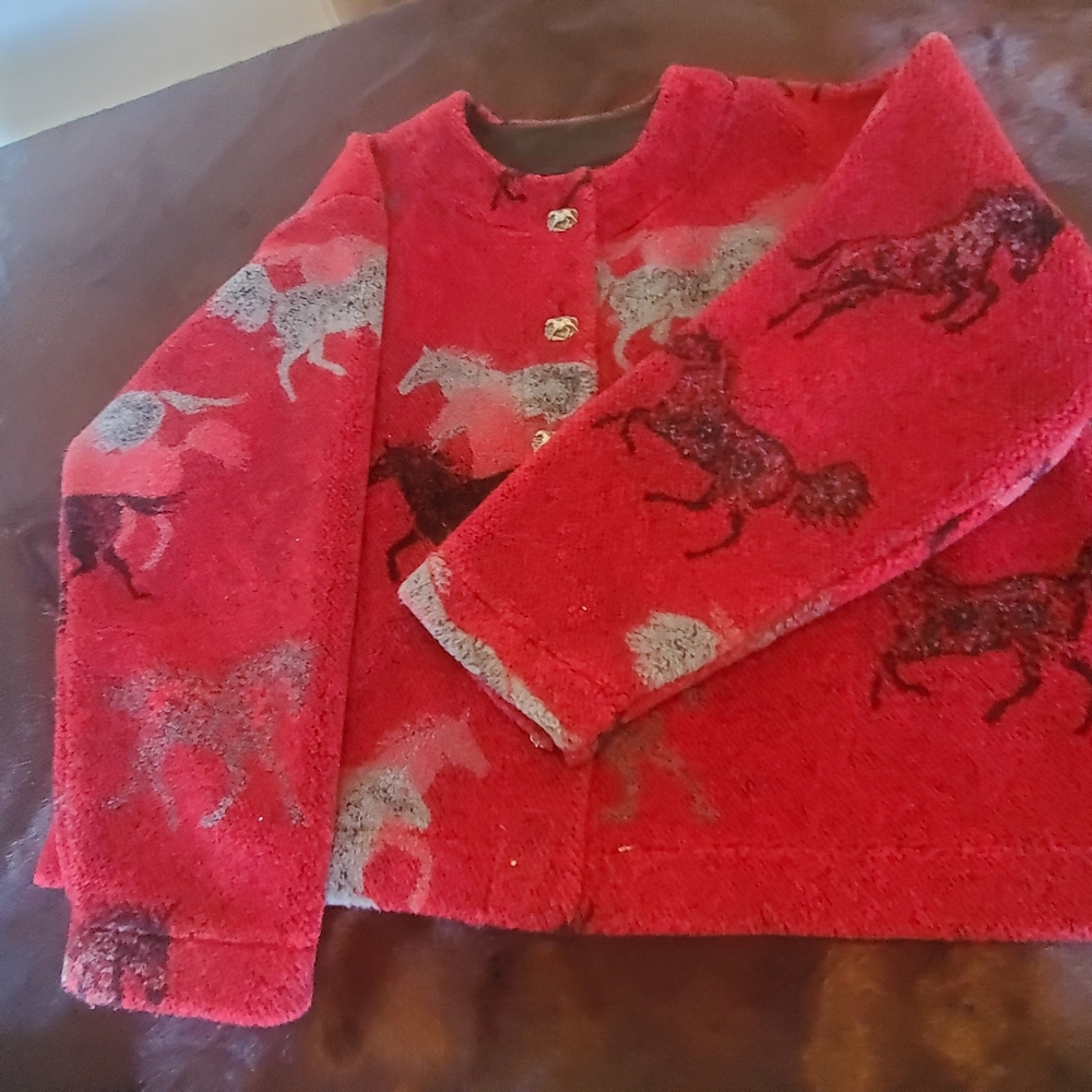 Jacket with horses on it.